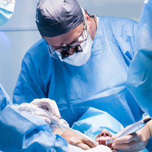 Oral surgeons performing dental implant surgery