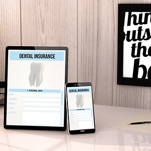 Dental insurance forms on tablet and phone